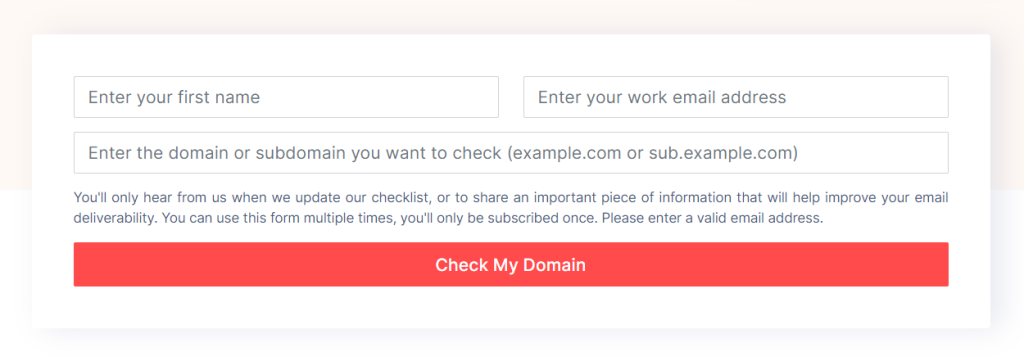Screenshot of the Check My Domain tool form with three input fields and a button. The fields are labeled 'Enter your first name,' 'Enter your work email address,' and 'Enter the domain or subdomain you want to check (example.com or sub.example.com).' Below the input fields, there is a note stating, 'You'll only hear from us when we update our checklist, or to share an important piece of information that will help improve your email deliverability. You can use this form multiple times, you'll only be subscribed once. Please enter a valid email address.' At the bottom, there is a red button labeled 'Check My Domain'.